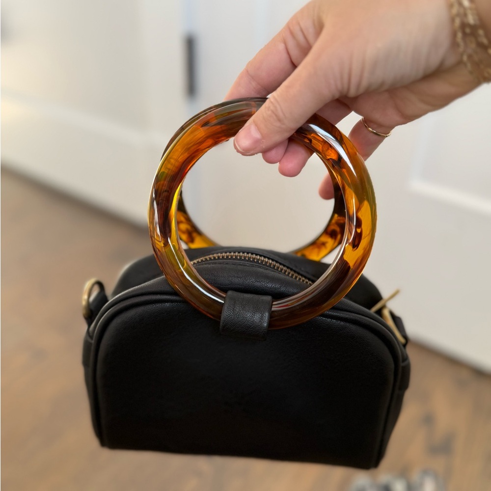 Nwot Anthropologie crossbody bag with faux tortoise shell handles. Faux leather.